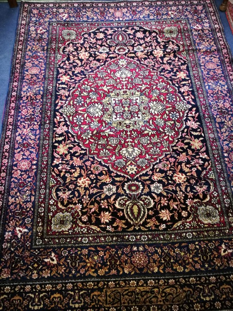A Kashan blue ground rug 200 x 143cm